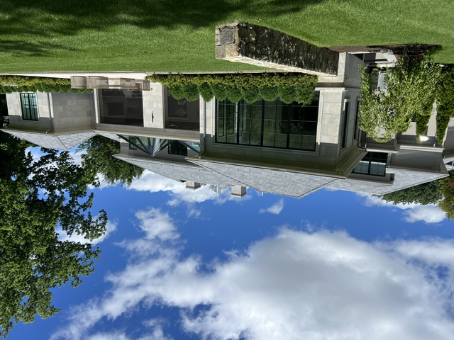 Chilton Development luxury stone custom home side and rear view