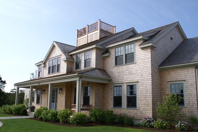 Chilton Development cedar shingle coastal home with hydrangeas and rooftop deck