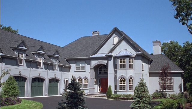 Yanoff Residence — French chateau-style mansion with arched windows built by Chilton Development